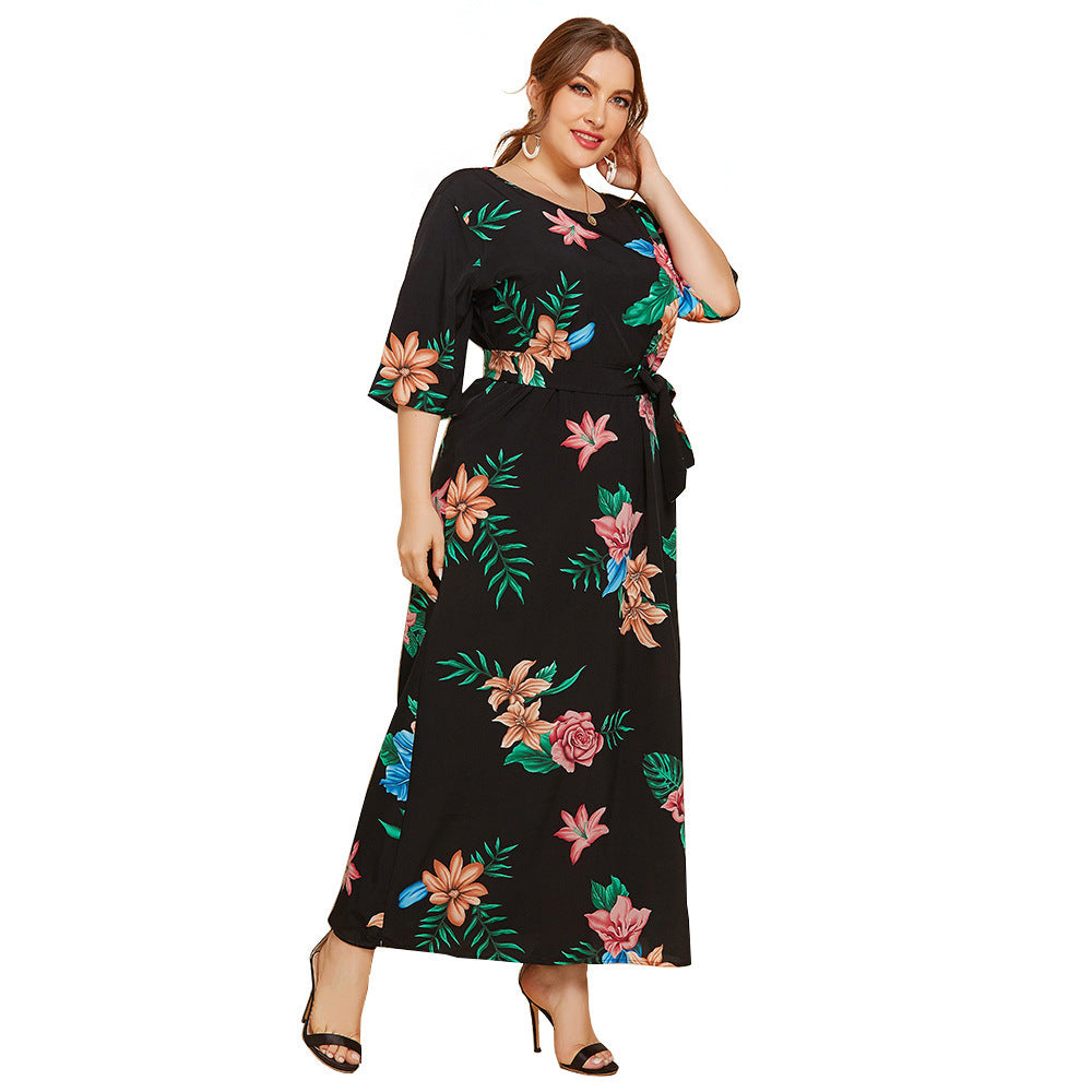Women's maxi dress with floral design and waist belt Caloria
