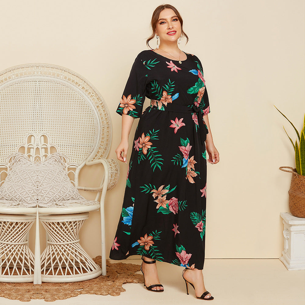 Women's maxi dress with floral design and waist belt Caloria
