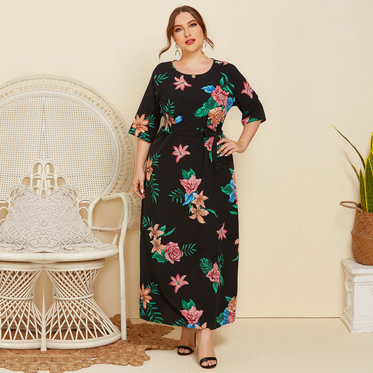 Women's maxi dress with floral design and waist belt Caloria