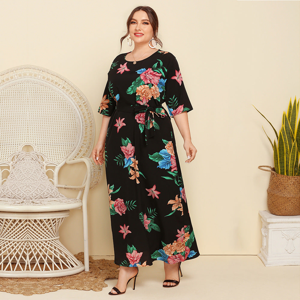 Women's maxi dress with floral design and waist belt Caloria
